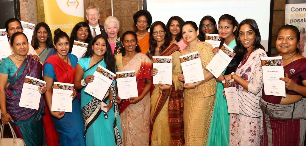 Women Trading Globally Short Course graduates display their certificates
