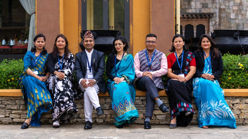 Dhiraj (third from right) pictured with fellow Nepali participants and members of the Australia Awards – Nepal team at the 2024 Regional Alumni Workshop on gender equality in Bhutan.