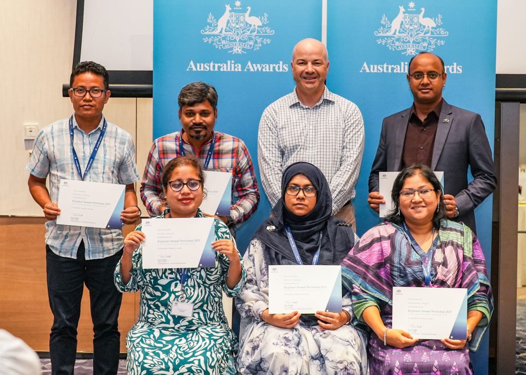 Arefeen (far left, front row) pictured with fellow Bangladeshi alumni receiving their certificates of participation at the 2025 Regional Alumni Workshop by Matthew Lapworth (second from right, back row), former Director of the South and Central Asia Development Section at Australia’s Department of Foreign Affairs and Trade.