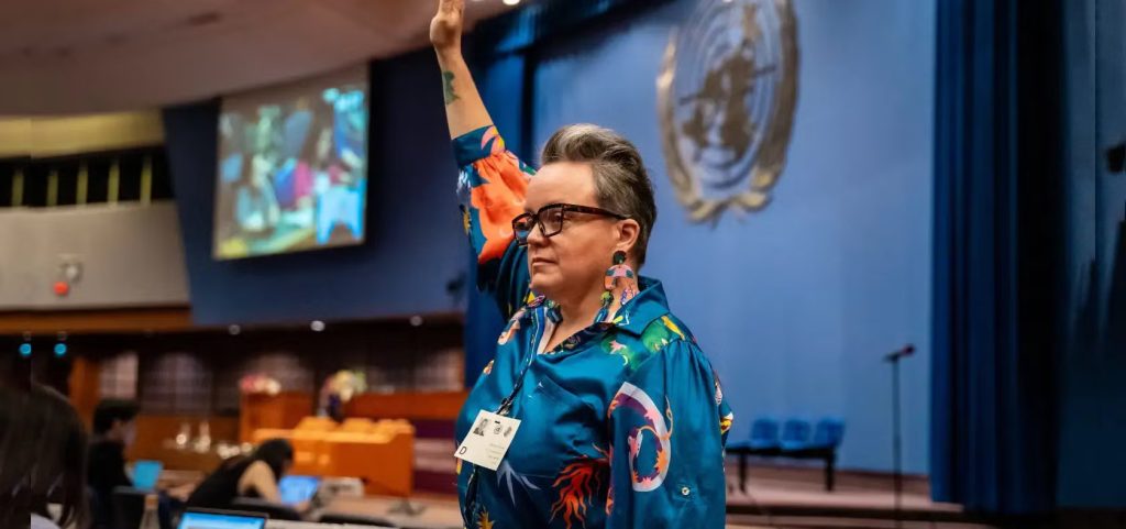 Clare Gibellini, Policy Officer at Women with Disabilities Australia, stands in the main conference during the Ministerial Conference. Photo courtesy: UN Women/Ploy Phutpheng