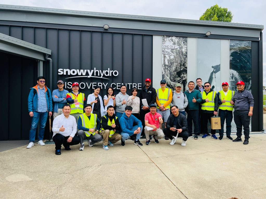 Ireedui (back row standing, seventh from right) with other Short Course participants visiting the Snowy Mountains Scheme.