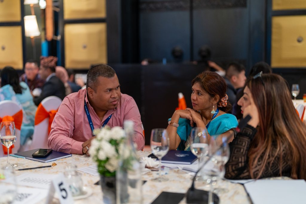 Alumnus Mirza (left) engaging with other participants at the 2024 Regional Alumni Workshop.