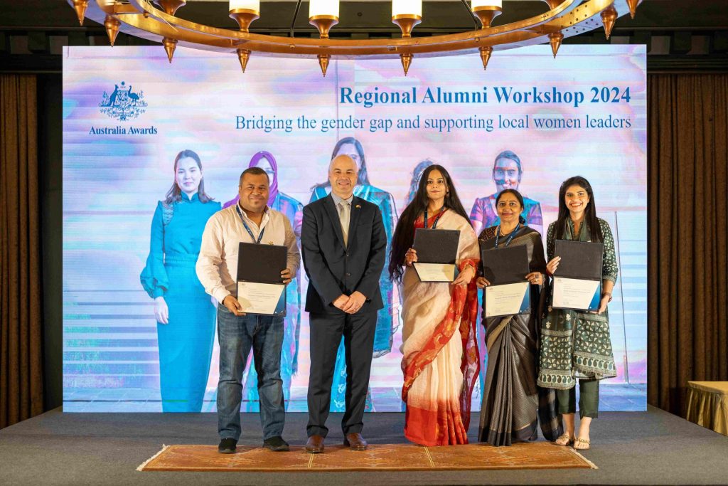 Mirza (left) with fellow alumni from India receiving certificates from Matthew Lapworth (second from left), former Director of the South and Central Asia Development Section of Australia’s Department of Foreign Affairs and Trade at the 2024 Regional Alumni Workshop.