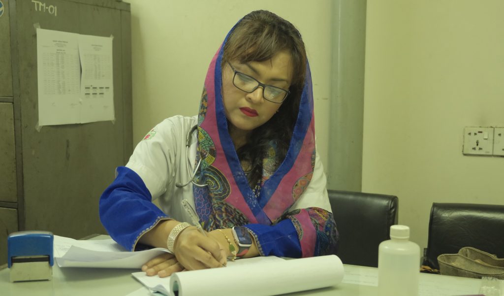 Farah pictured at her desk in the hospital.