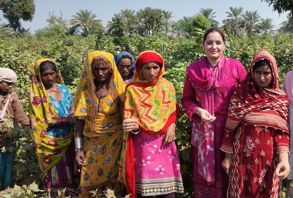 Cotton fields, renewed hope: A group of women with new prosthetic limbs in a Sindh cotton field. Zarqa featured second from right.