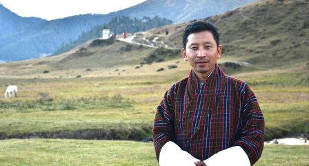 Rinchen Dorji standing in a Bhutanese mountain landscape