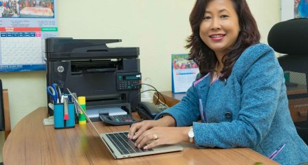 Australia Awards alumna Nibha Shrestha working at her desk