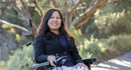 Special-education advocate Rajuna Singh using a powered wheelchair outdoors